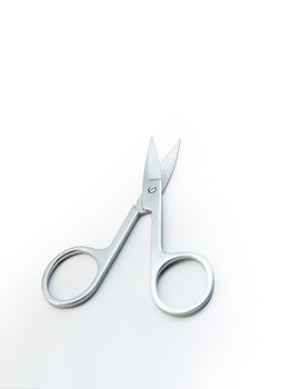 Small steel nail scissors on white background