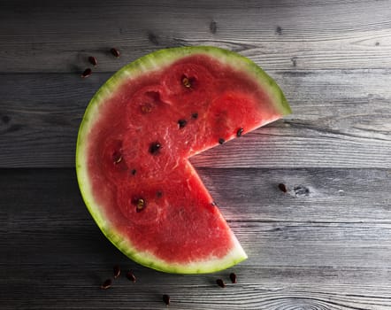 Watermelon slice on the isolated wooden background. With clipping path