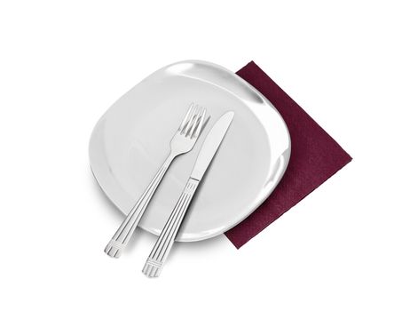 White plate, fork and knife on brown napkin. Isolated on white. With clipping path