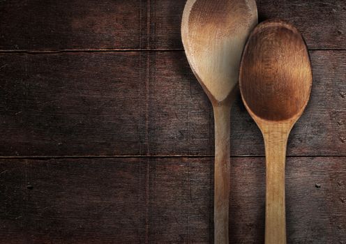 old wooden spoons on the wood table