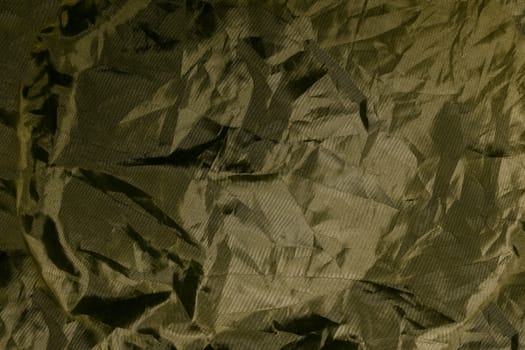 Golden rough fabric grunge texture background.