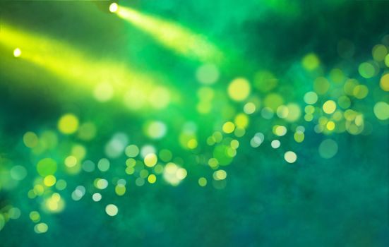 Stage light projector and yellow glitter lights on green background. Abstract Spotlight Glitter lights background.