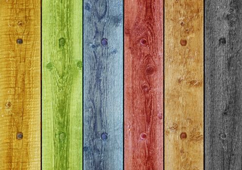 Old boards painted in different colors. Background old panel with rusty nails