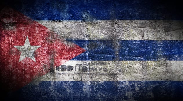 Grungy Flag of Cuba on stone texture background closeup