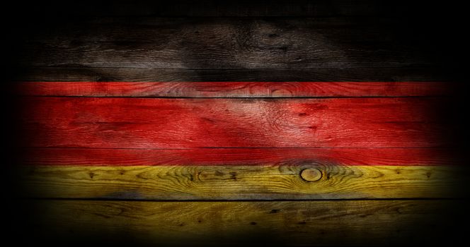 Flag of Germany painted on grungy wood plank