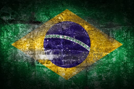 Grunge Brazil flag on stone texture background closeup