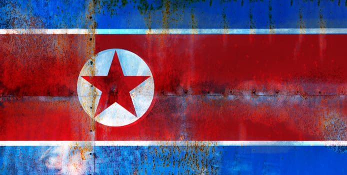 Grungy Flag of North Korea on the metal rusty surface. Vintage effect.