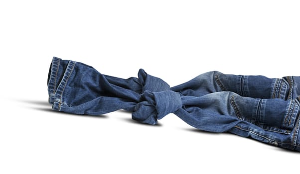 Blue jeans tied to node isolated on white background. With clipping path