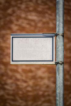 Grungy Blank White Street Sign For Your Text Against A Blurred Red Brick Wall Background