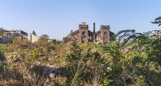 Old abandoned industrial factory Krayan in Odessa, Ukraine, in a sunny summer day