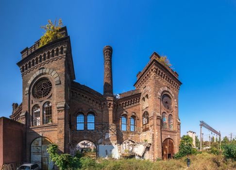 Old abandoned industrial factory Krayan in Odessa, Ukraine, in a sunny summer day