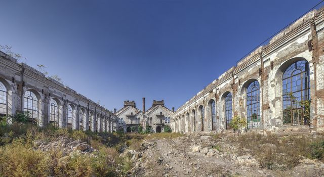 Old abandoned industrial factory Krayan in Odessa, Ukraine, in a sunny summer day