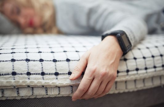 Woman sleeping with smart watch