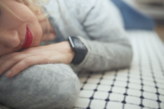 Woman sleeping with smart watch