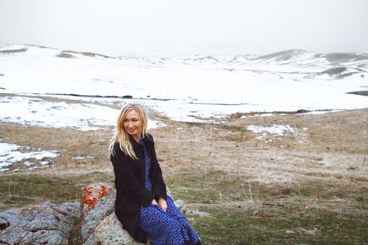 Smiling woman in the winter landscape