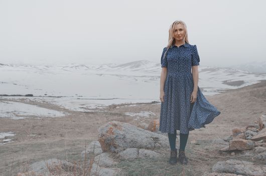 Happy woman having fun in the winter landscape