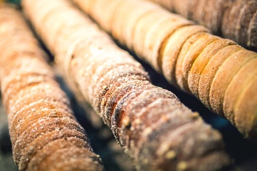 Sugarcoated rolls, traditional sweet pastry, street food, Trdelnik, Prague Czech Republic