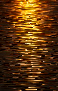 Abstract Background Texture Of Golden Sunset Sunlight Reflected On Water