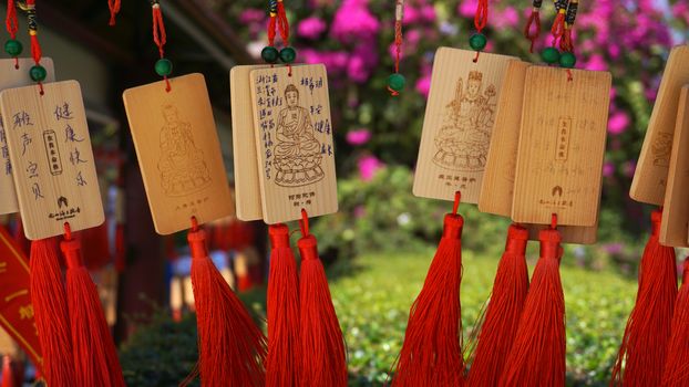 eople write and hang Ema Wood tag or Wooden label for praying for good luck happy other at Sanya, China