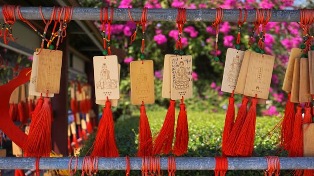 eople write and hang Ema Wood tag or Wooden label for praying for good luck happy other at Sanya, China