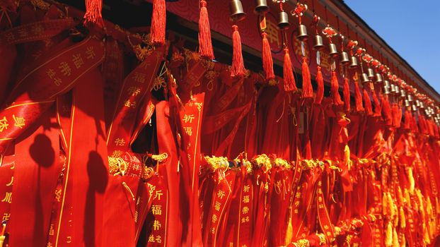 eople write and hang Ema Wood tag or Wooden label for praying for good luck happy other at Sanya, China