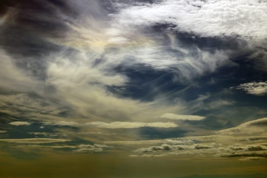 Fiery sunset sky. Sky background with clouds