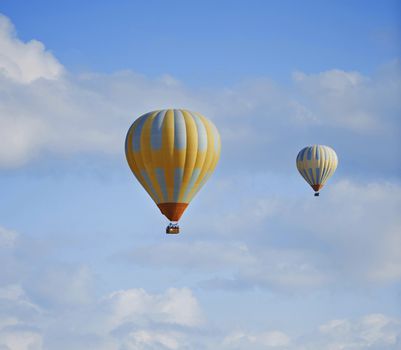 Two hot air balloons flying in the sky
