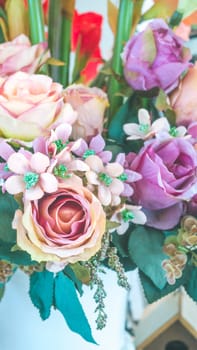 colorful of the plastic flowers bouquet , soft of focus