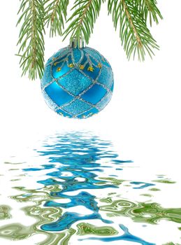 Blue christmas ball on a branch of Christmas tree isolated on a white background, reflected in the water surface with small waves