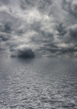 Dramatic sky covered with dark clouds and stormy sea