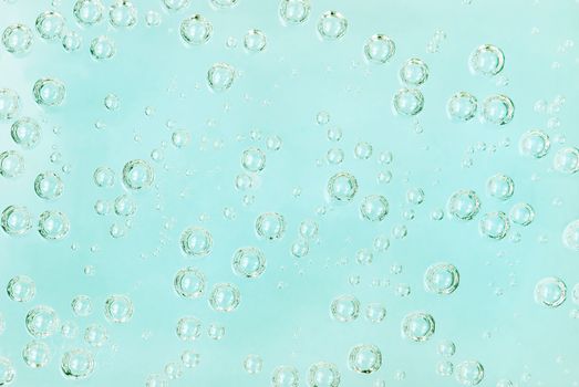 Different soda bubbles on a blue background