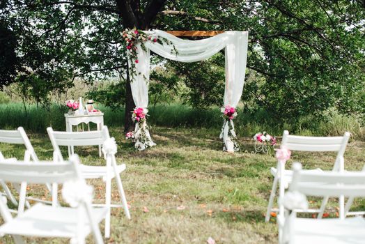 wedding ceremony area, arch chairs decor