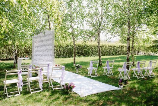 wedding ceremony area, arch chairs decor