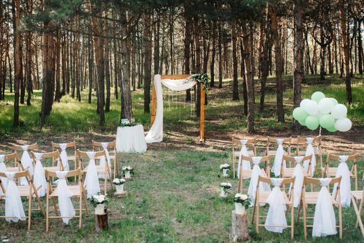 wedding ceremony area, arch chairs decor