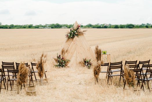 wedding ceremony area, arch chairs decor