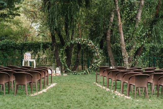 wedding ceremony area, arch chairs decor