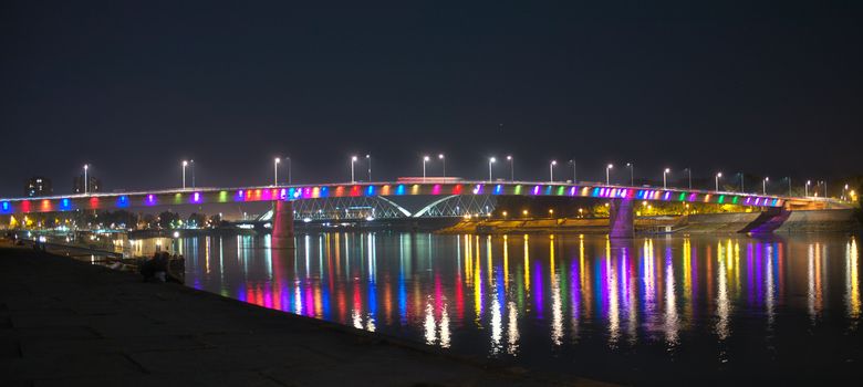 Night view on colorful bridge over Danube