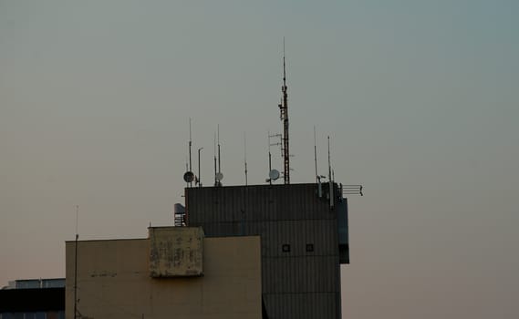 Various antennas on top of a building