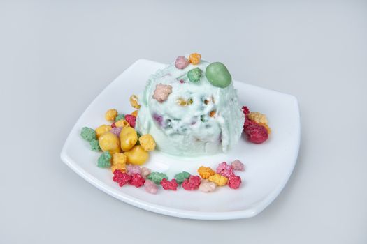 Icecream with different ingredients on a studio neutral background