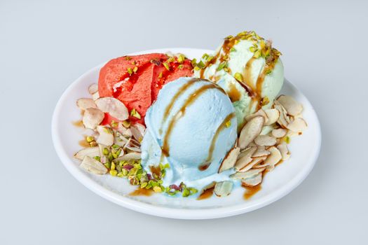 Icecream with different ingredients on a studio neutral background