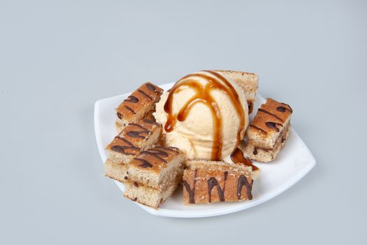 Icecream with different ingredients on a studio neutral background