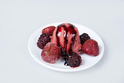 Icecream with different ingredients on a studio neutral background