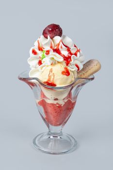 Icecream with different ingredients on a studio neutral background