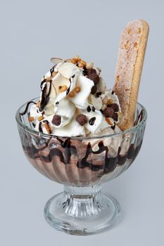 Icecream with different ingredients on a studio neutral background