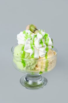 Icecream with different ingredients on a studio neutral background