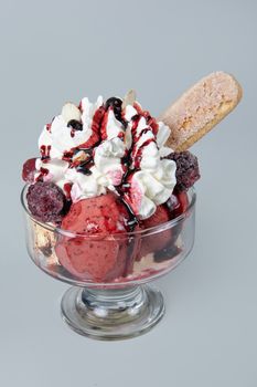 Icecream with different ingredients on a studio neutral background