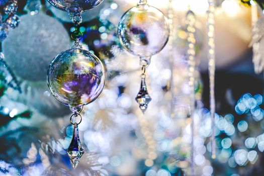 crystal ball christmas tree decoration blue background elegant closeup .