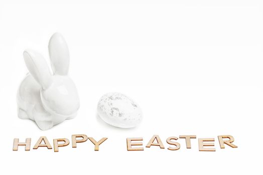 Happy Easter. Easter white bunny on a white background with Easter eggs.Easter greeting card with easter bunny.Happy Easter.