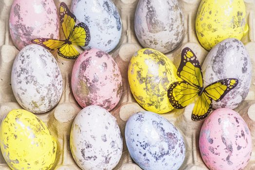 Happy Easter. Multi-colored Easter eggs in the egg cells. Easter card. Close-up.Soft focus.