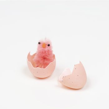 colored easter eggs with little chicks on a white surface